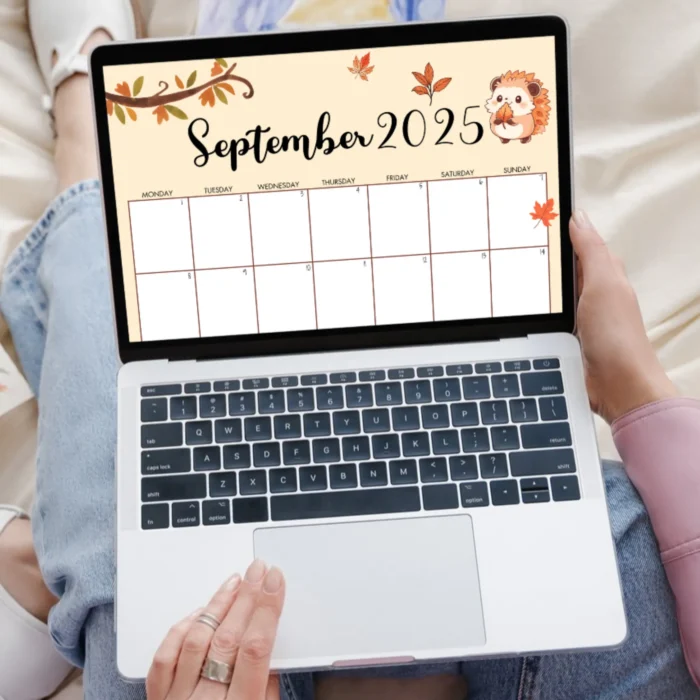 Autumn calendar viewed on a laptop with seasonal illustrations and warm color tones