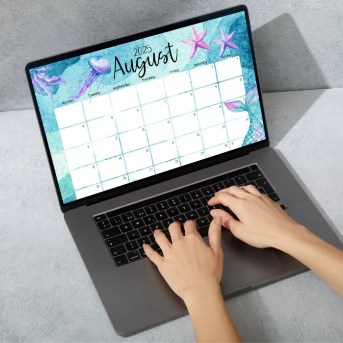 User typing on laptop while using fillable mermaid-themed August calendar